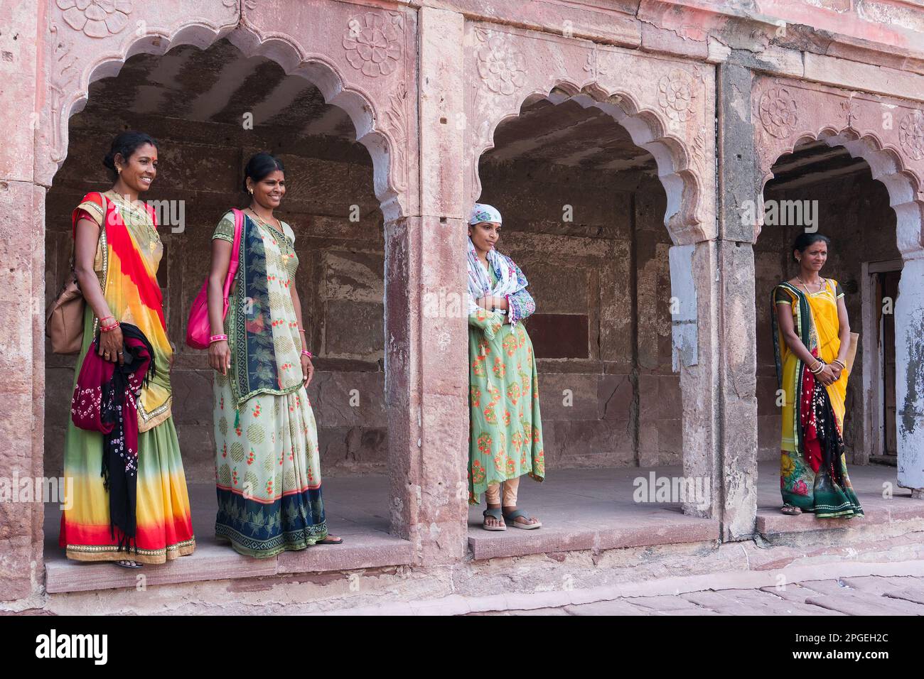 Jodhpur, Rajasthan, India - 19th October 2019 : Beautiful middle aged Rajasthani women posing wearing traditional colourful rajasthani dresses. Stock Photo