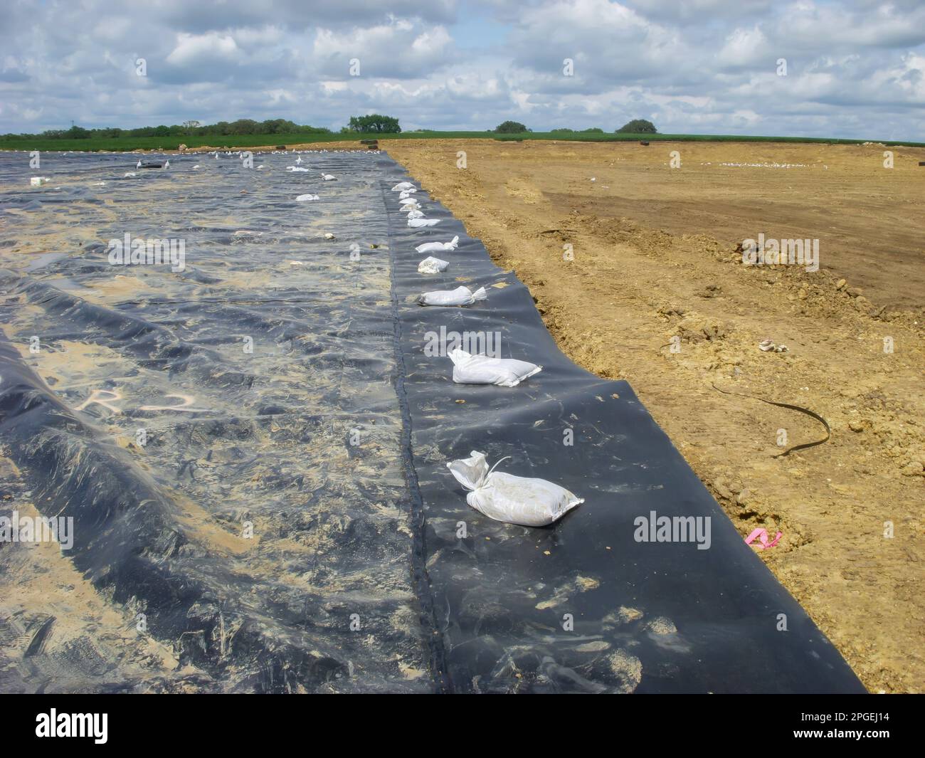 Landfill expansion project with clay cover and HDPE synthetic liner