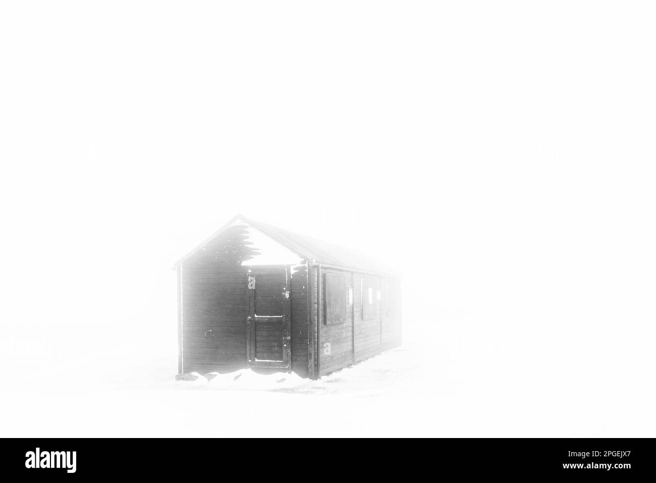 Remote hut locked up on a snowy and foggy day, West Yorkshire, England, UK Stock Photo