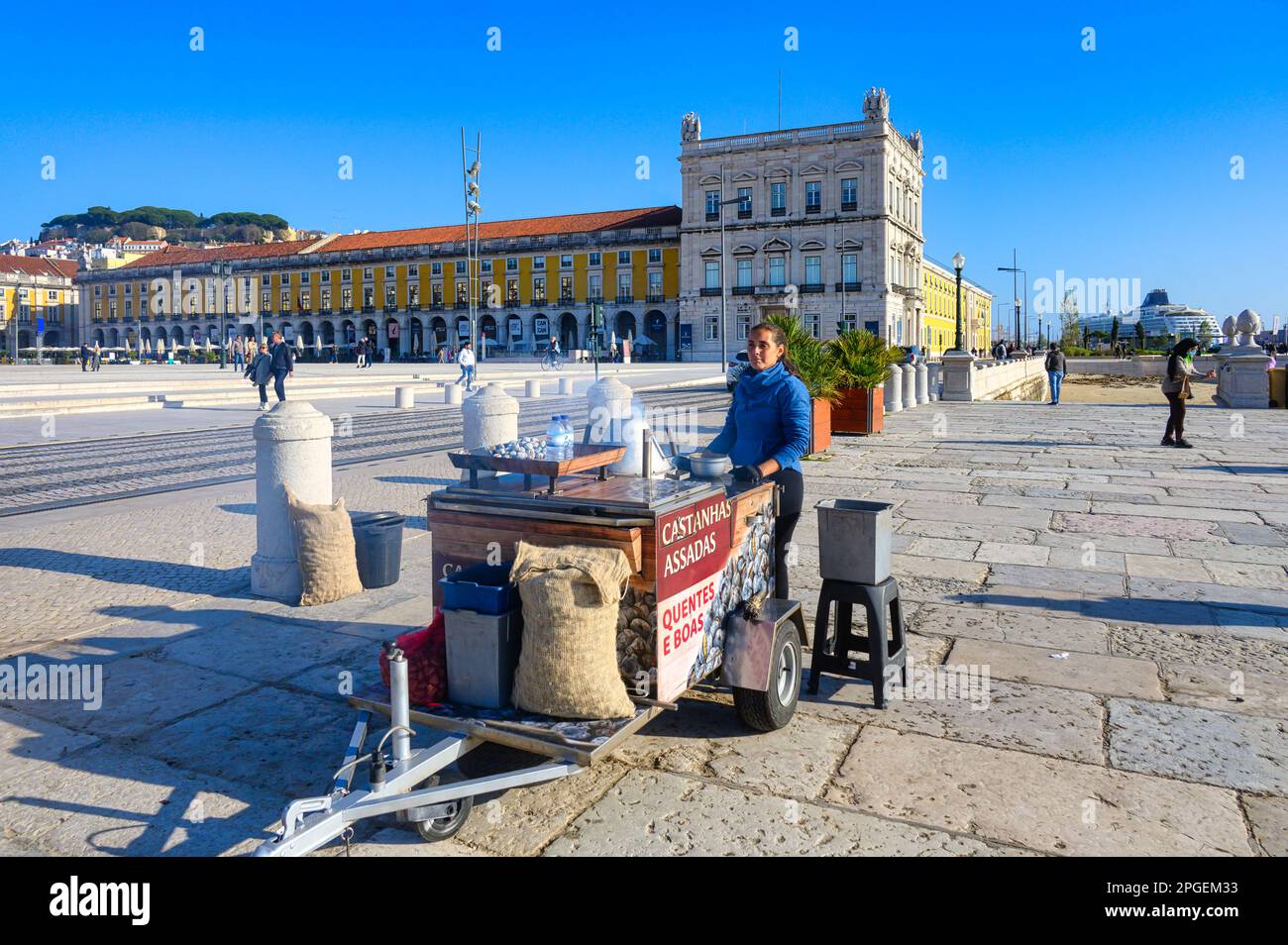 Woman selling roasted chestnuts in Commerce Square, Lisbon, Portugal Stock Photo