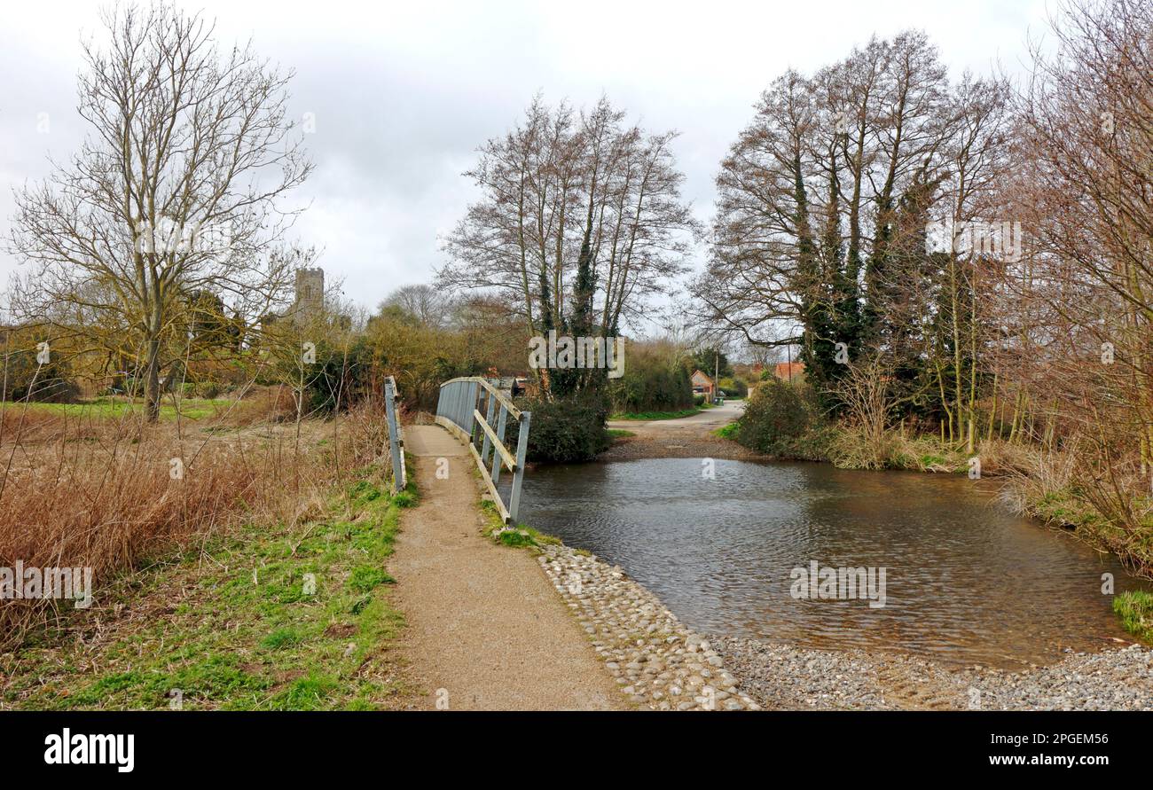 A view of the ford and footbridge over the River Glaven in North Norfolk at Glandford, Norfolk, England, United Kingdom. Stock Photo