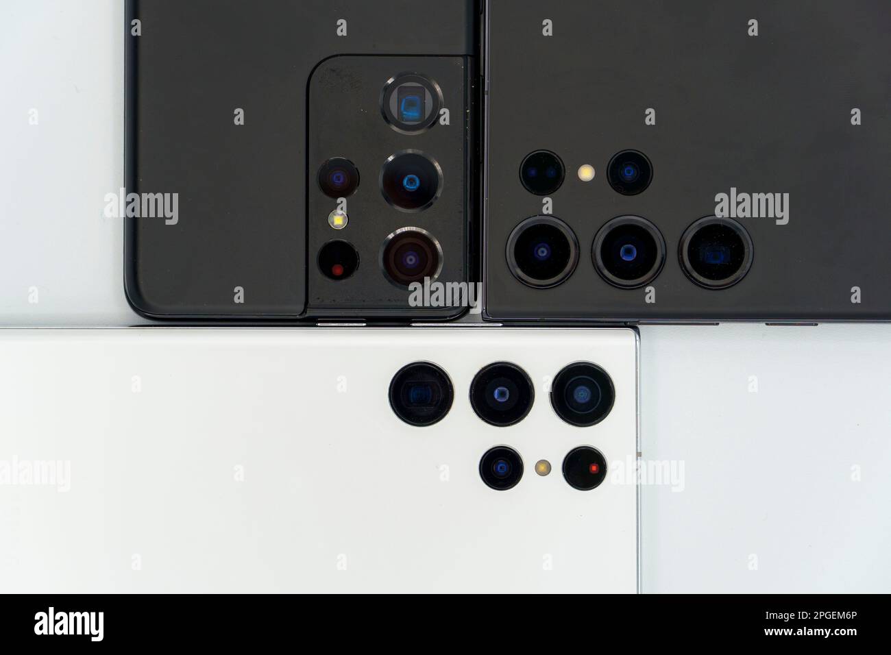 Close up of the ultrawide, normal and telephoto camera lenses on three flagship Samsung Galaxy