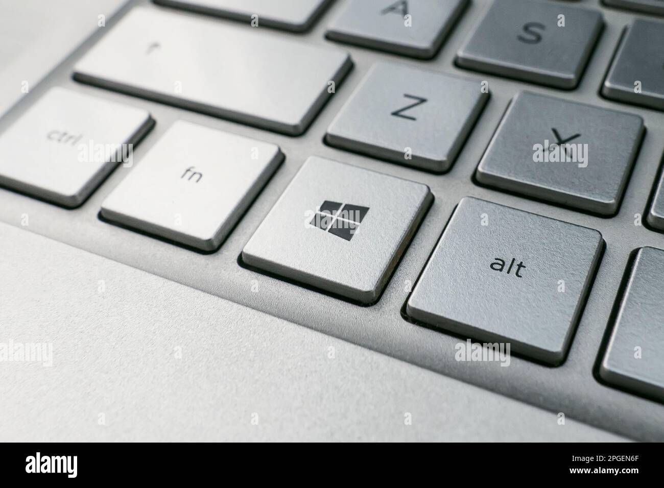 November 2, 2021. Barnaul, Russia. button with the logo Windows on the grey keyboard of a modern laptop. Stock Photo