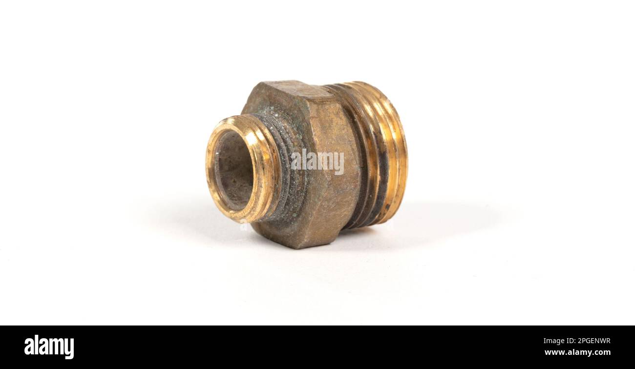 Brass fitting for plumbing pipes, connector for two different sizes, isolated on white Stock