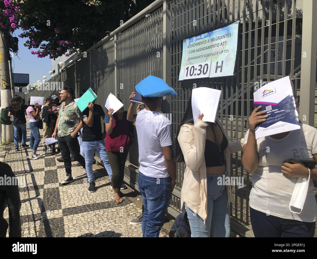 Passport office long queue hi-res stock photography and images - Alamy