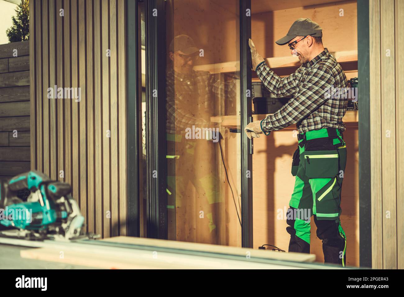 Caucasian Windows and Doors Contractor Installing Aluminium Frame
