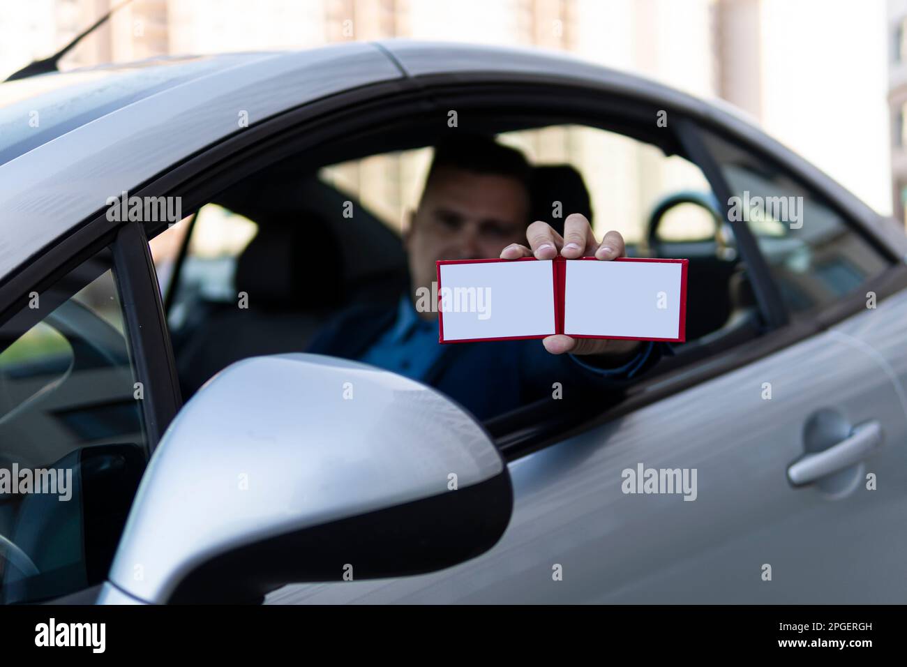 Parliamentary immunity, concept disregard for the law. An official with a high position in society shows a document. diplomat shows a special pass. bl Stock Photo