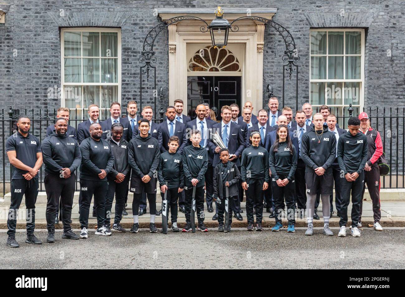 Downing Street, London, UK. 22nd March 2023. Jos Buttler and the England cricket team pose for photos following a reception in 10 Downing Street to celebrate winning the T20 World cup. They were accompanied by young players and other representatives of England Cricket. Photo by Amanda Rose/Alamy Live News Stock Photo
