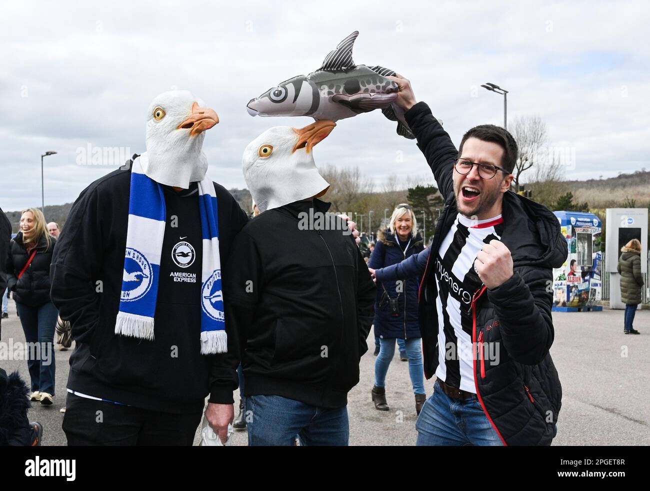 Brighton Seagulls fans and Grimsby Haddock fans mixing before  the Emirates FA Cup quarter final match between Brighton and Hove Albion and Grimsby Town at the American Express Community Stadium  , Brighton UK - 19 March 2023 -  Photo Simon Dack/Telephoto Images Editorial use only. No merchandising. For Football images FA and Premier League restrictions apply inc. no internet/mobile usage without FAPL license - for details contact Football Dataco Stock Photo