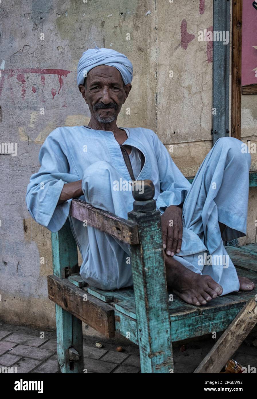 Portrait of an Egyptian man seated on a chair. Luxor, Egypt Stock Photo