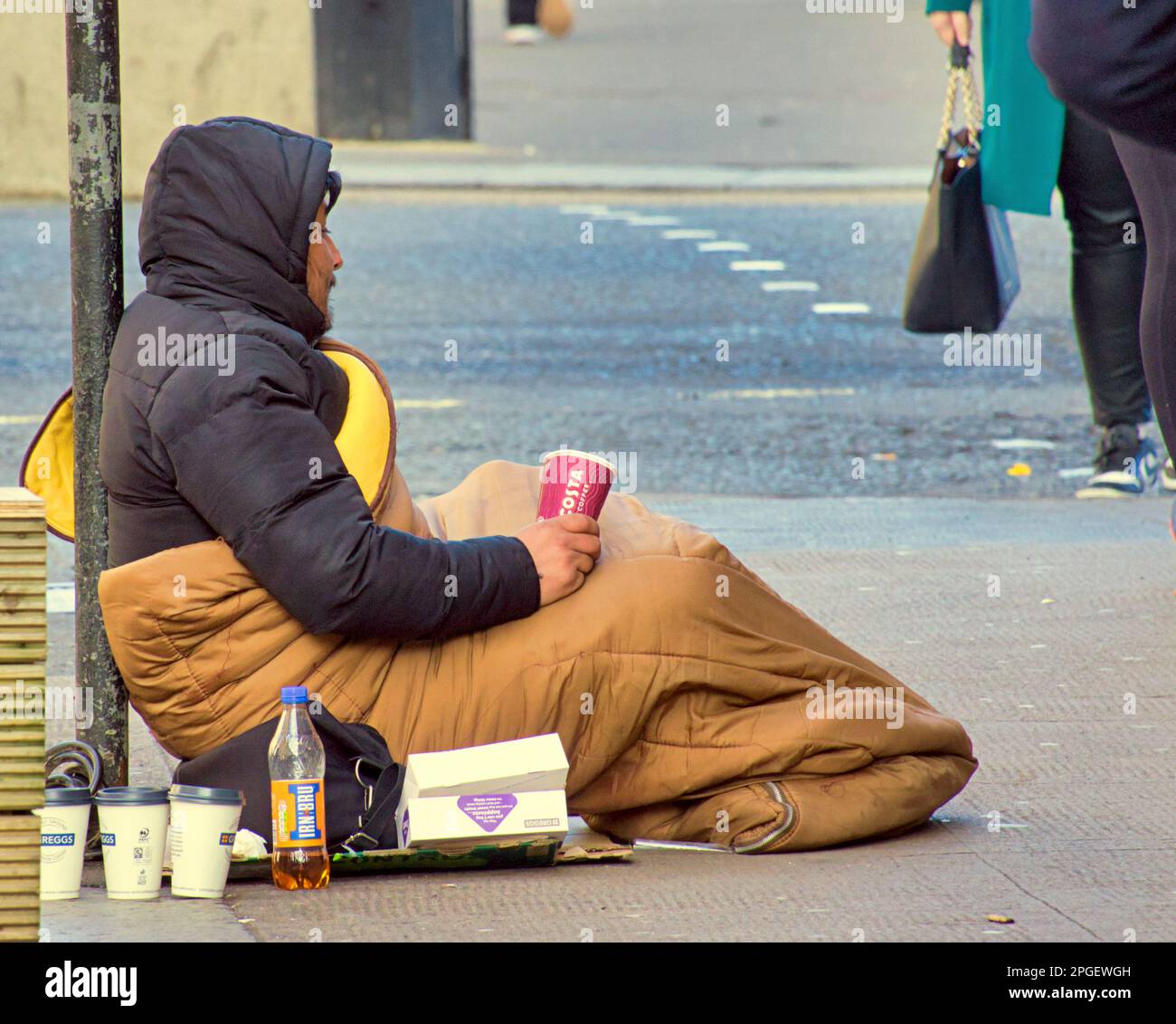 homeless person begging Stock Photo