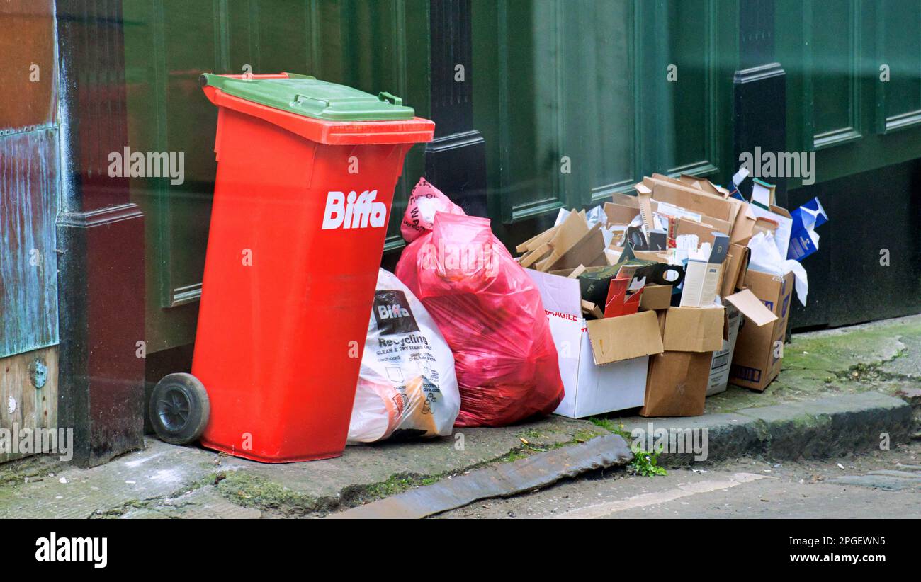 overflowing bins on the street Stock Photo