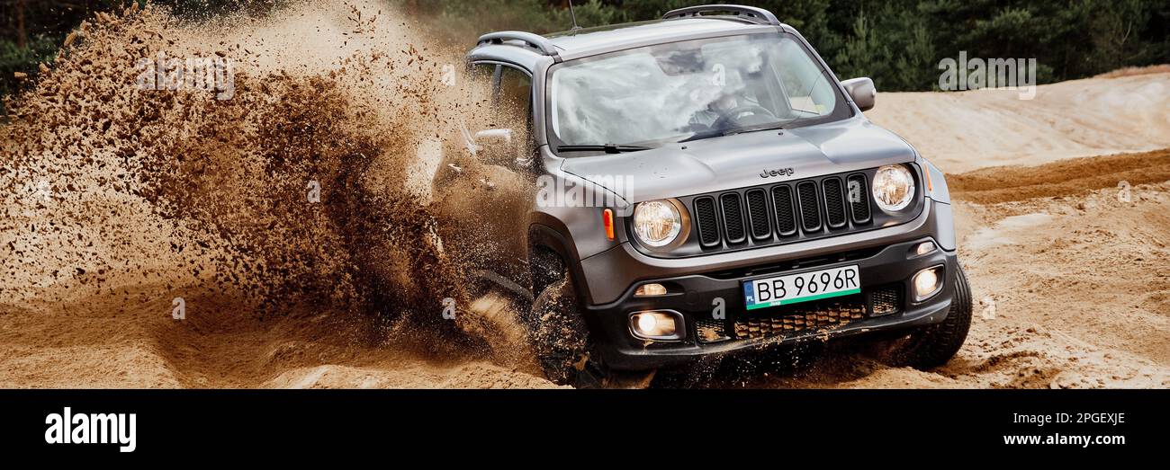 Fun in the desert with a 4x4 car. Jeep Renegade is doing great in the  slushy sand. Siedlce Desert, Poland - 07.02.2017 Stock Photo - Alamy