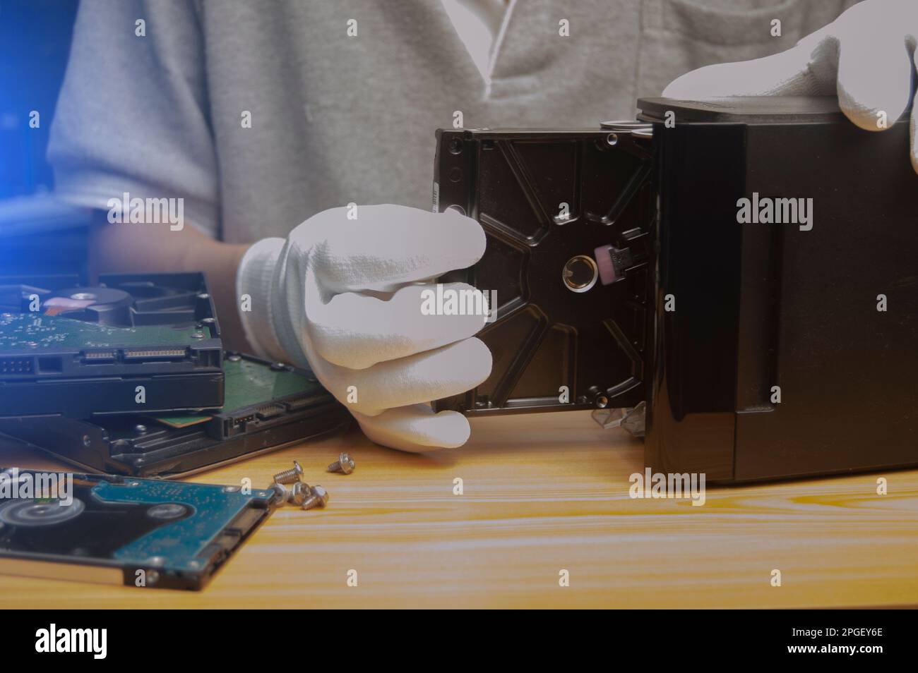 side view Technician installing hard drive Stock Photo