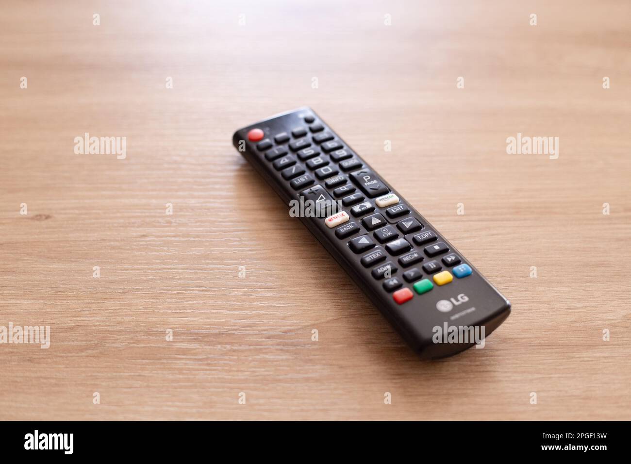 tv remote control on wooden table Stock Photo