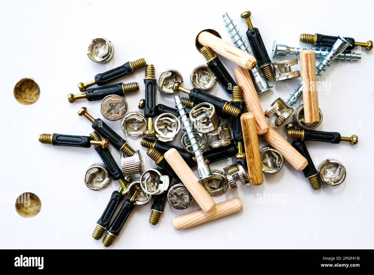 Furniture fittings closeup. A pile of a various assembly fittings on a