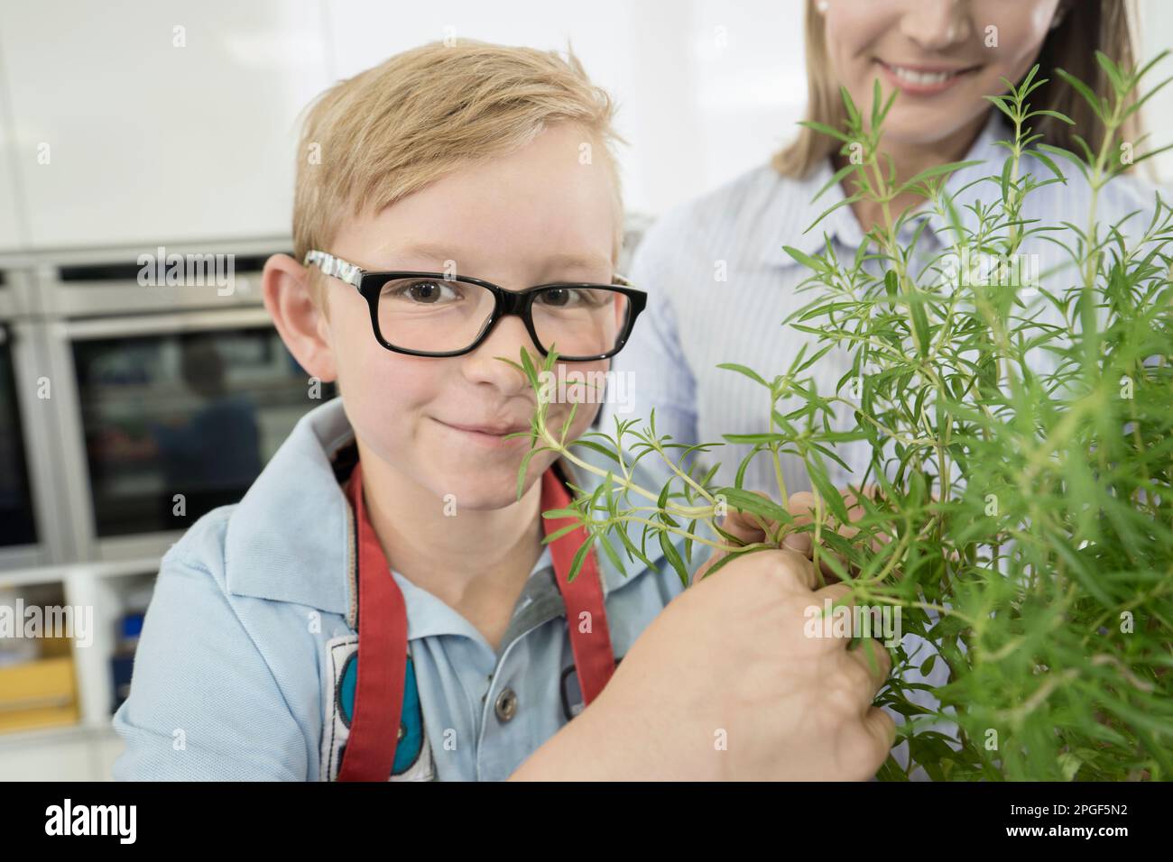 Child smelling food in pot hi-res stock photography and images - Alamy