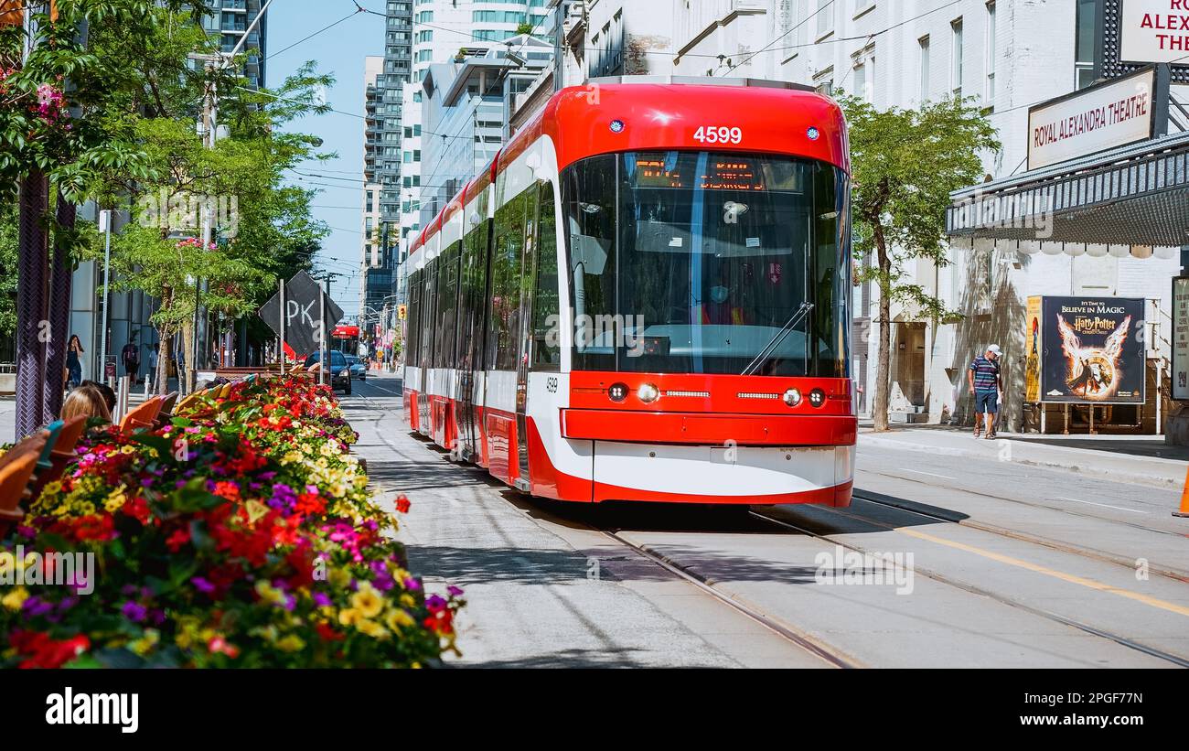 Street view of new TTC Bombardier-made streetcar in downtown Toronto's entertainment district. New Toronto Transit Commision tram on streets of Toront Stock Photo