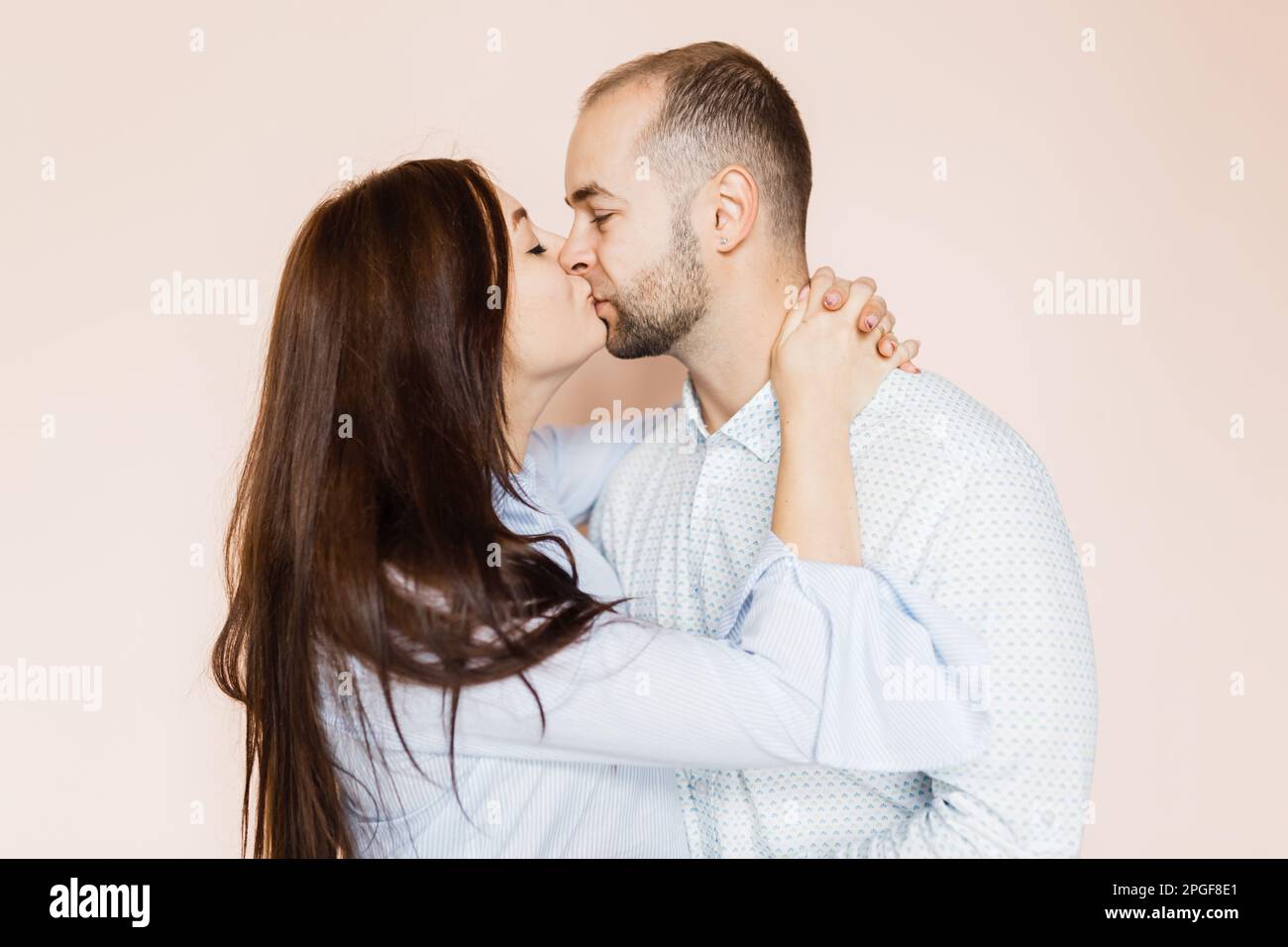 man and a woman in love pose for a family portrait Stock Photo - Alamy