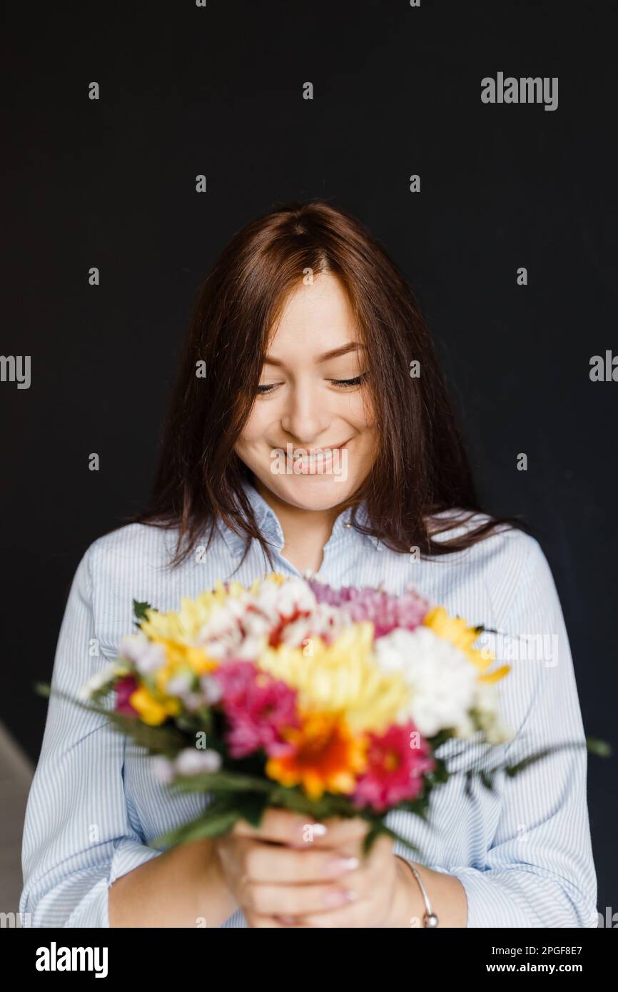 Positive woman in blue shirt hi-res stock photography and images - Alamy