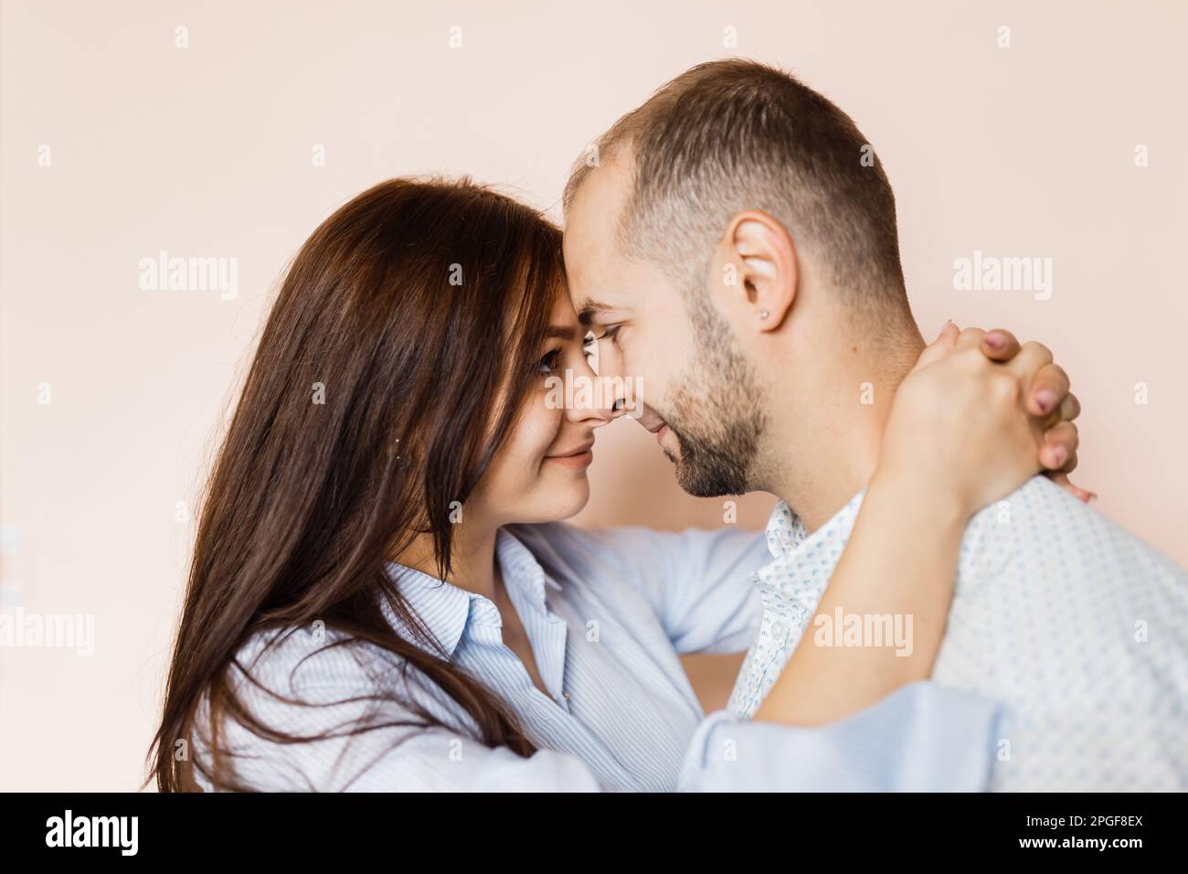 man and a woman in love pose for a family portrait Stock Photo - Alamy