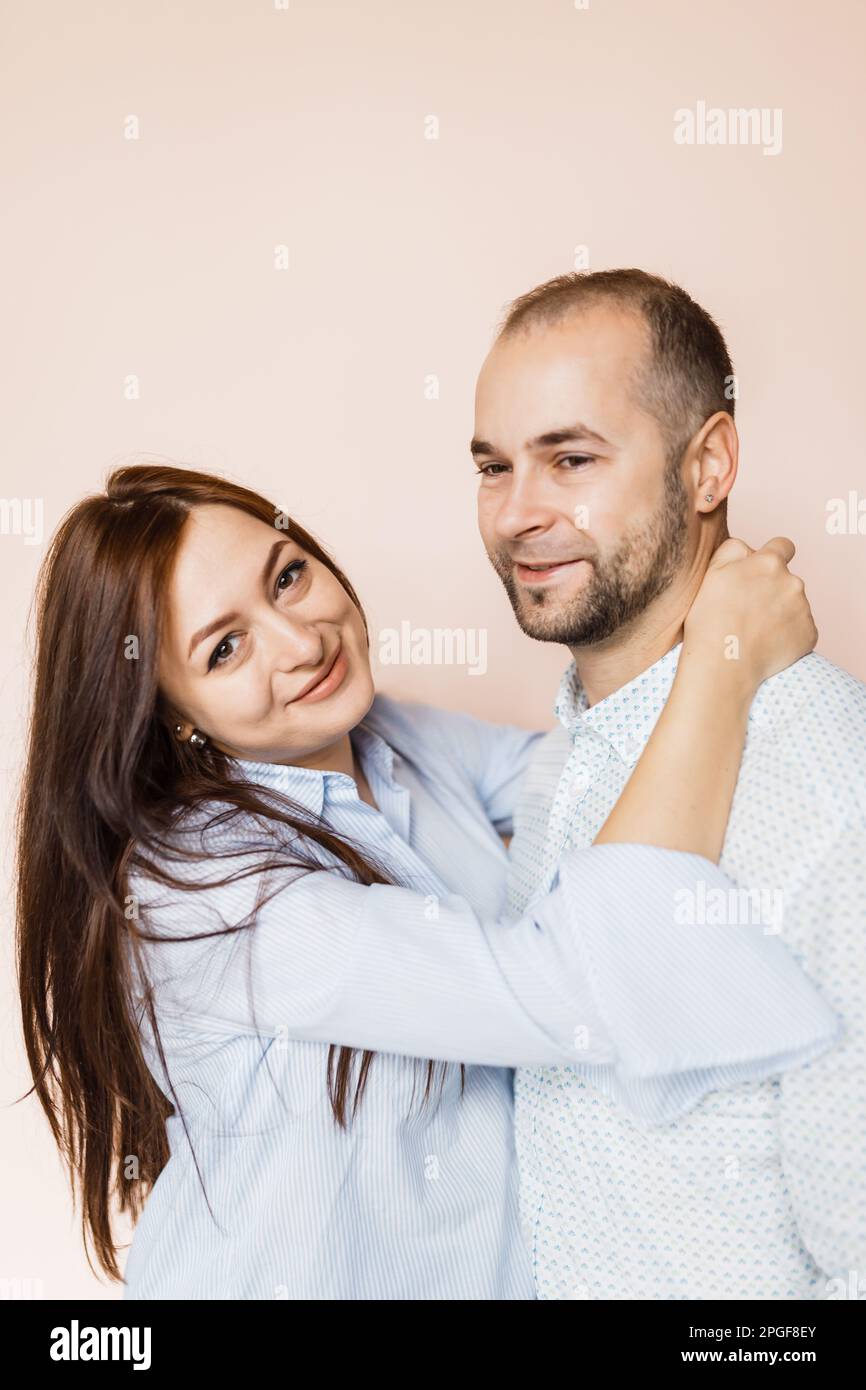 man and a woman in love pose for a family portrait Stock Photo - Alamy