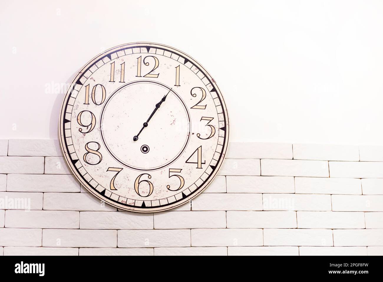 round wall clock on the wall. time translation, horizontal Stock Photo Alamy