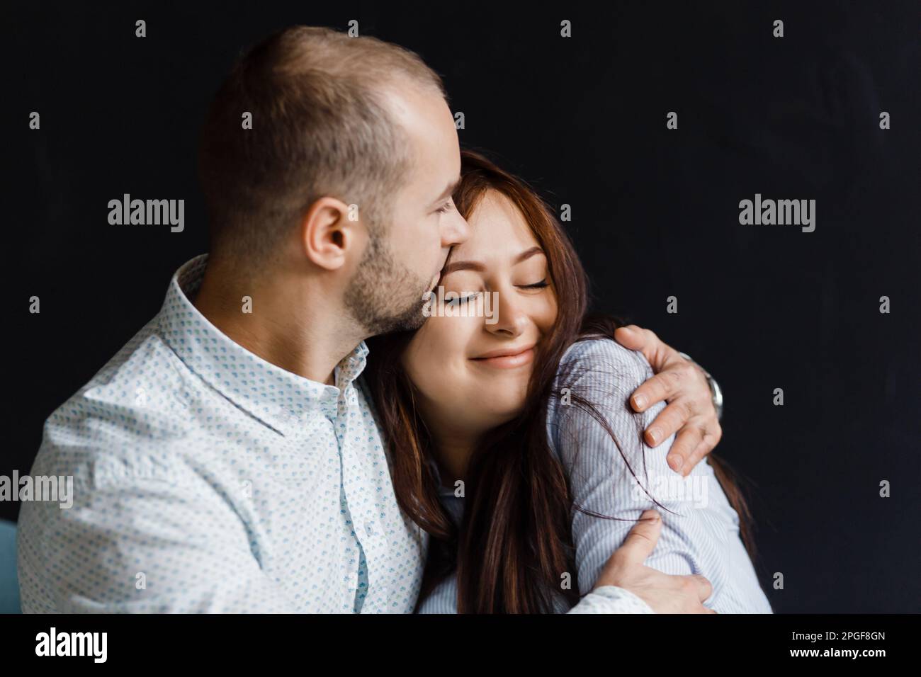 man and a woman in love pose for a family portrait, hugging Stock Photo ...