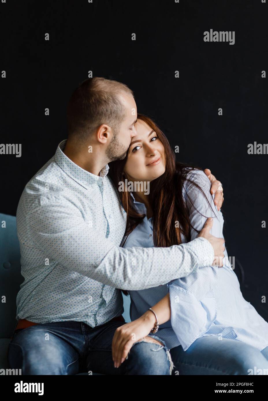 man and a woman in love pose for a family portrait, hugging Stock Photo ...