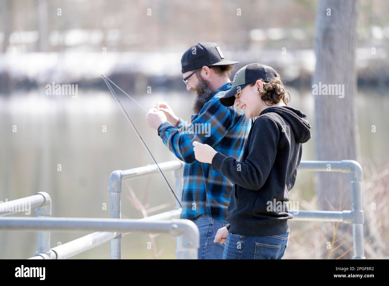 https://c8.alamy.com/comp/2PGF8R2/oliver-hunt-and-his-son-oliver-bait-hooks-at-the-cheshire-reservoir-for-a-day-of-fishing-in-the-sunshine-in-cheshire-mass-wednesday-march-22-2023-they-didnt-have-a-lot-of-luck-but-they-were-able-to-try-various-baits-and-lures-to-knock-the-rust-off-ben-garverthe-berkshire-eagle-via-ap-2PGF8R2.jpg