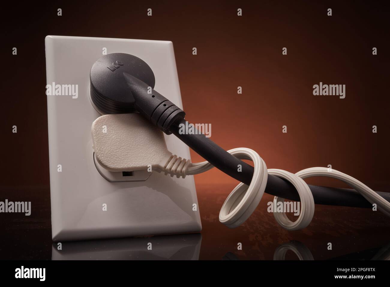 Electrical outlet with entangled power cords Stock Photo Alamy