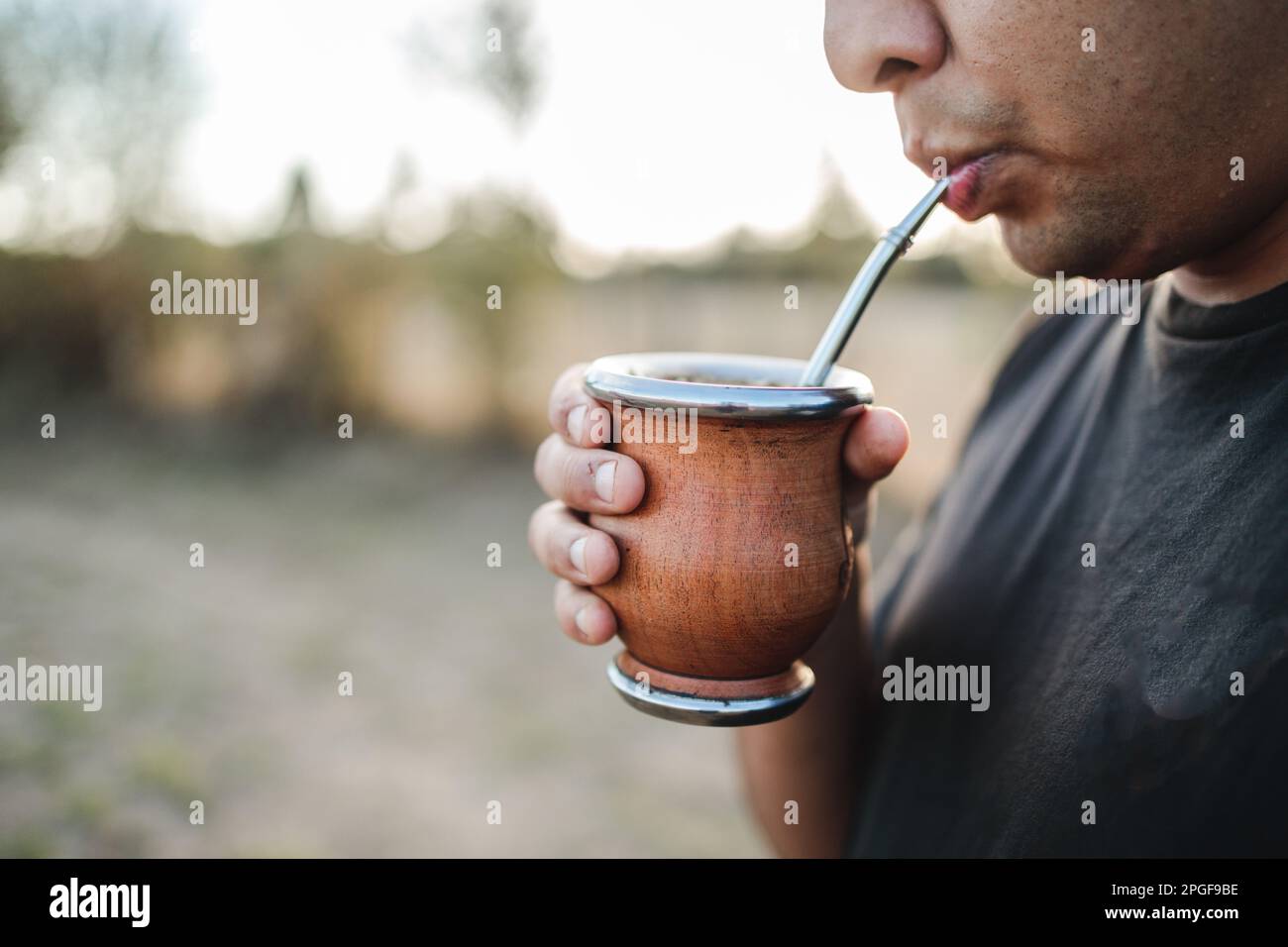 Suarez Tea Unrecognizable young latin man drinking yerba mate in the countryside ...