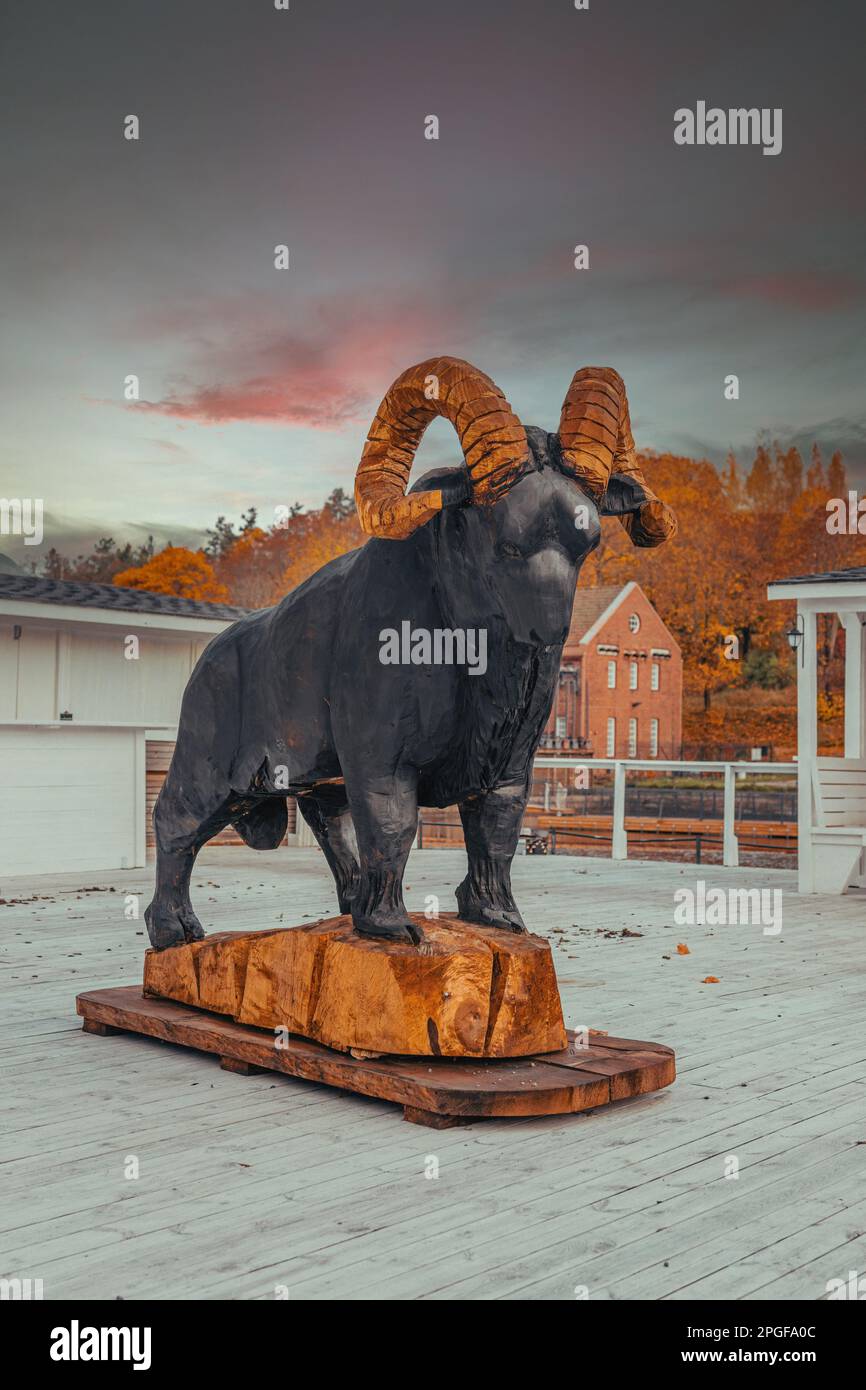 Black goat Statue with gold horns Stock Photo