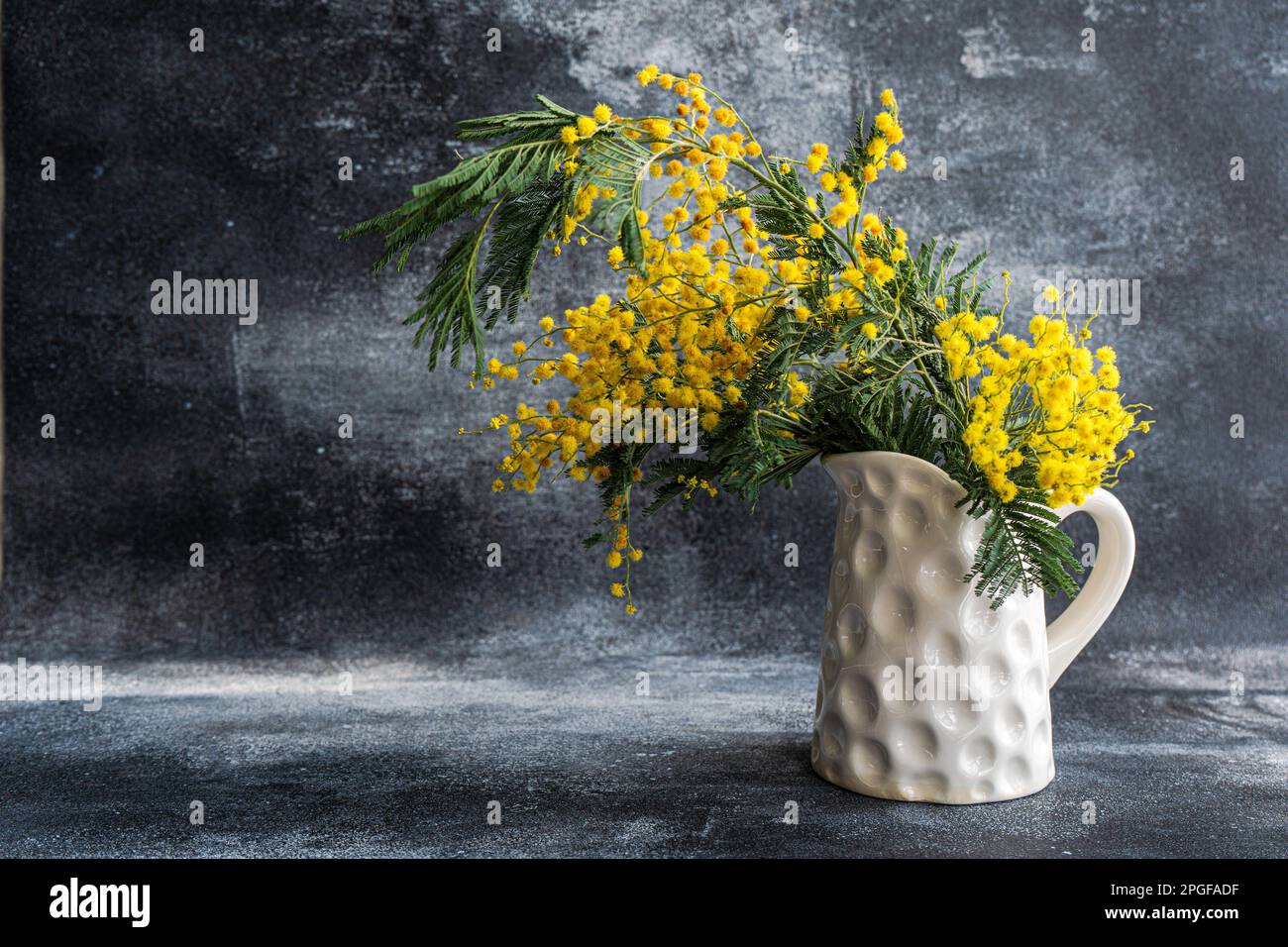 Spring yellow mimosa flowers in interior Stock Photo - Alamy
