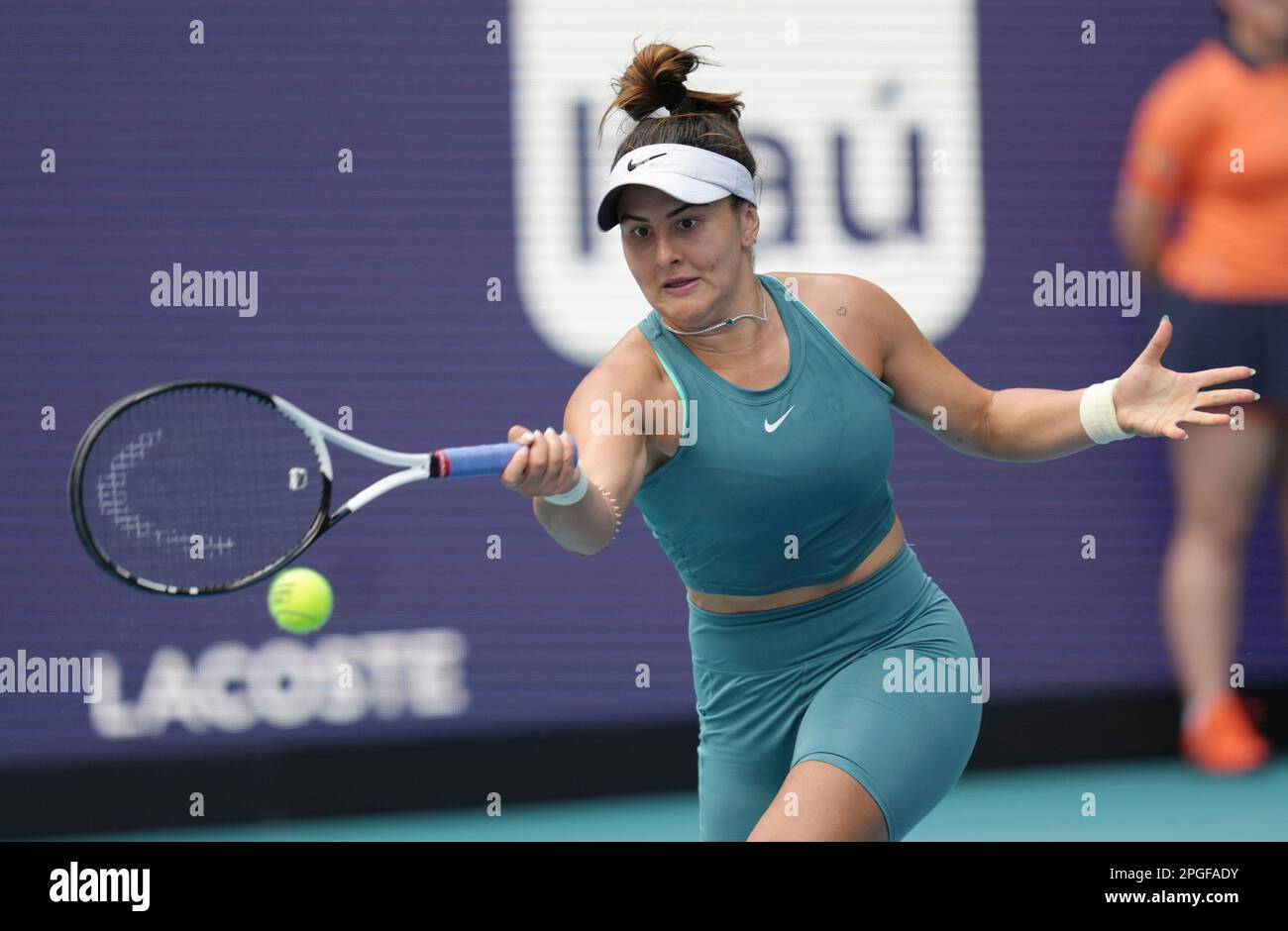 Bianca Andreescu, of Canada, returns a volley from Emma Raducanu, of