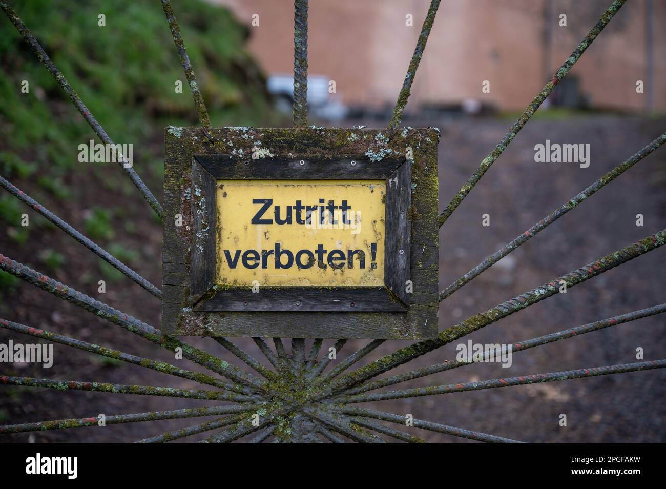 Closeup yellow german Zutritt verboten, access forbidden sign on a old