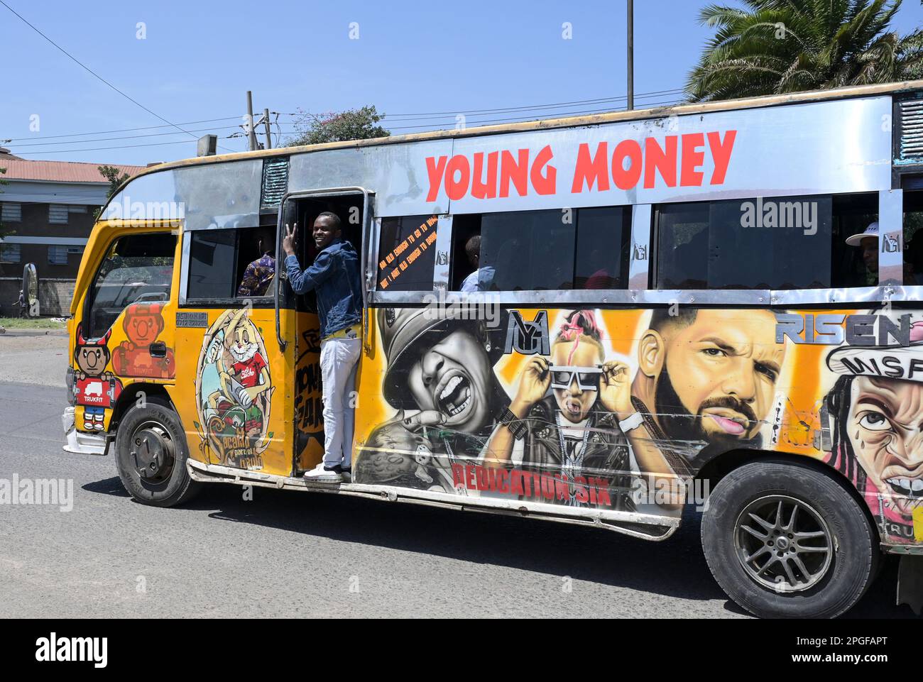 KENYA, Nairobi, Graffiti street art and traffic, colorful painted SACCO mini bus Matatu / KENIA, Nairobi, Verkehr, mit Graffiti bunt bemalte Minibus Matatu Stock Photo