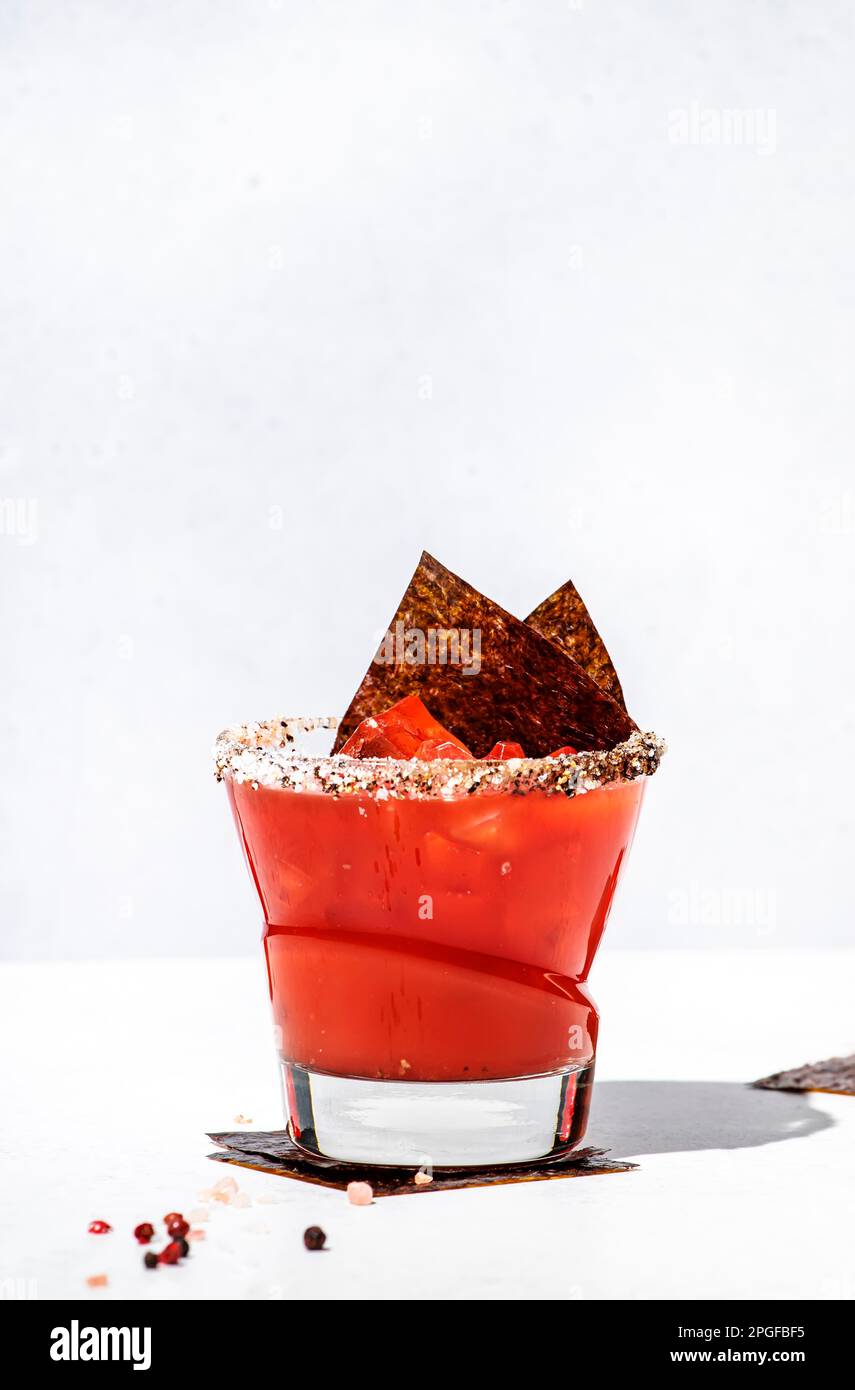 Miso mary alcoholic cocktail drink with tomato juice, spices, vodka and