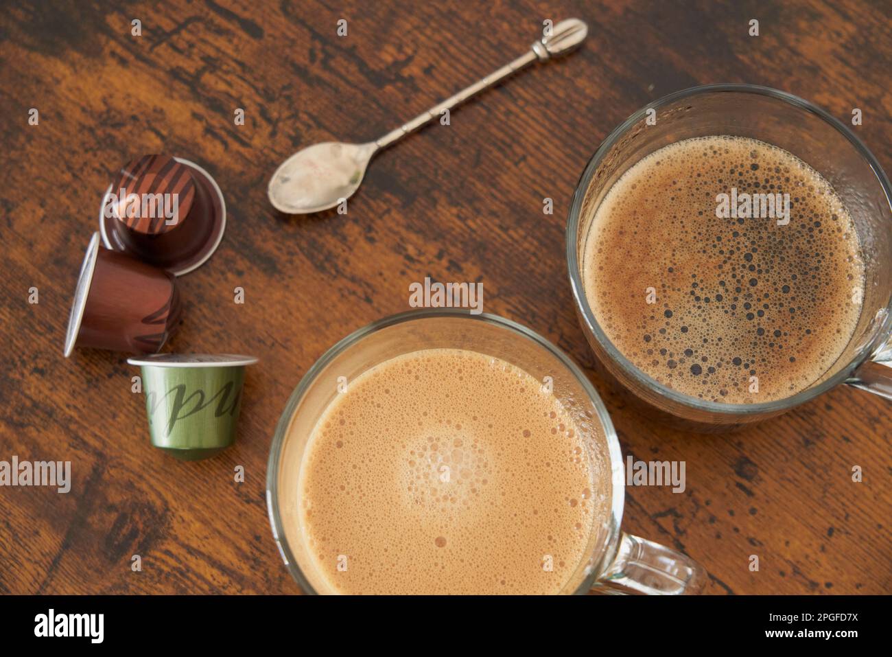 Cups of latte and black coffee with espresso capsules Stock Photo