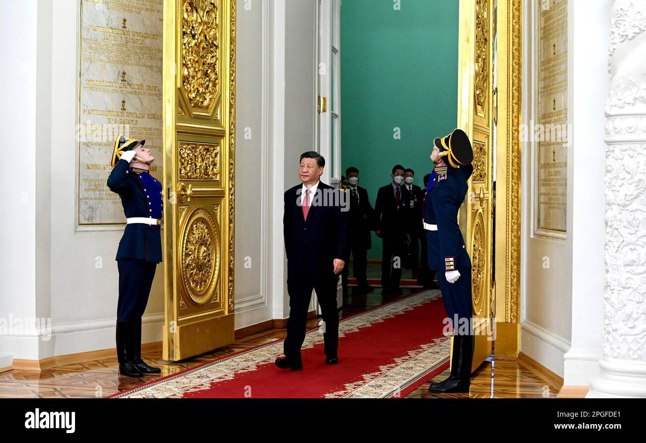 Moscow, Russia. 21st Mar, 2023. Chinese President Xi Jinping, center, walks past the Russian Presidential Guard as he arrives for the official State arrival ceremony at the Kremlin Palace, March 21, 2023 in Moscow, Russia. Credit: Pavel Byrkin/Kremlin Pool/Alamy Live News Stock Photo
