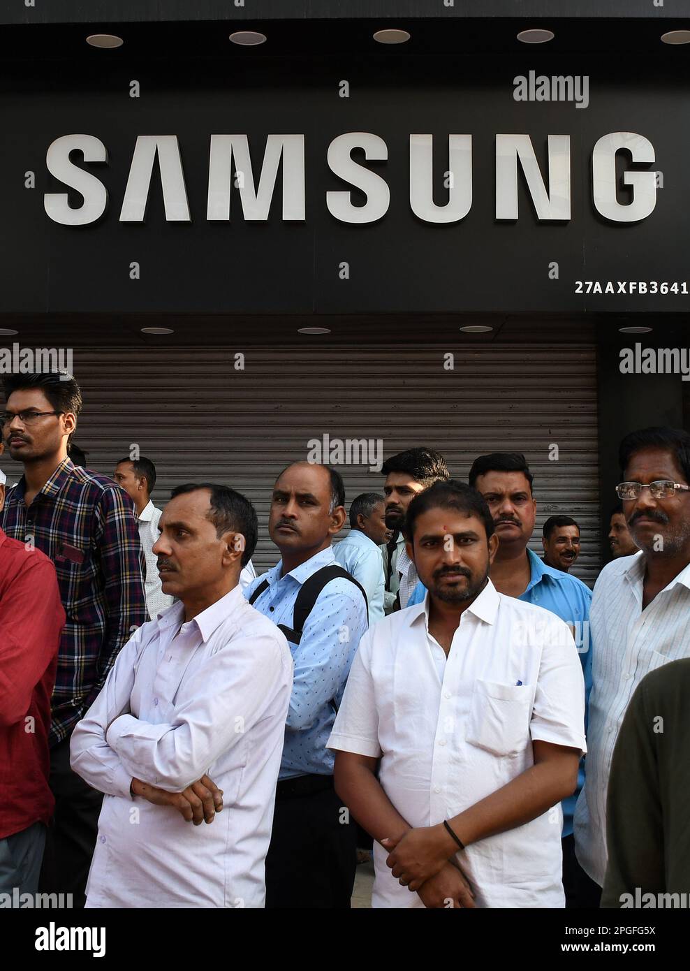 Mumbai, India. 22nd Mar, 2023. People are seen standing below a Samsung logo in Mumbai. Samsung mobile phones are on the list of top 10 mobile phone brands in the year 2023 providing the best of innovation and technology to its customers around the world. (Photo by Ashish Vaishnav/SOPA Images/Sipa USA) Credit: Sipa USA/Alamy Live News Stock Photo