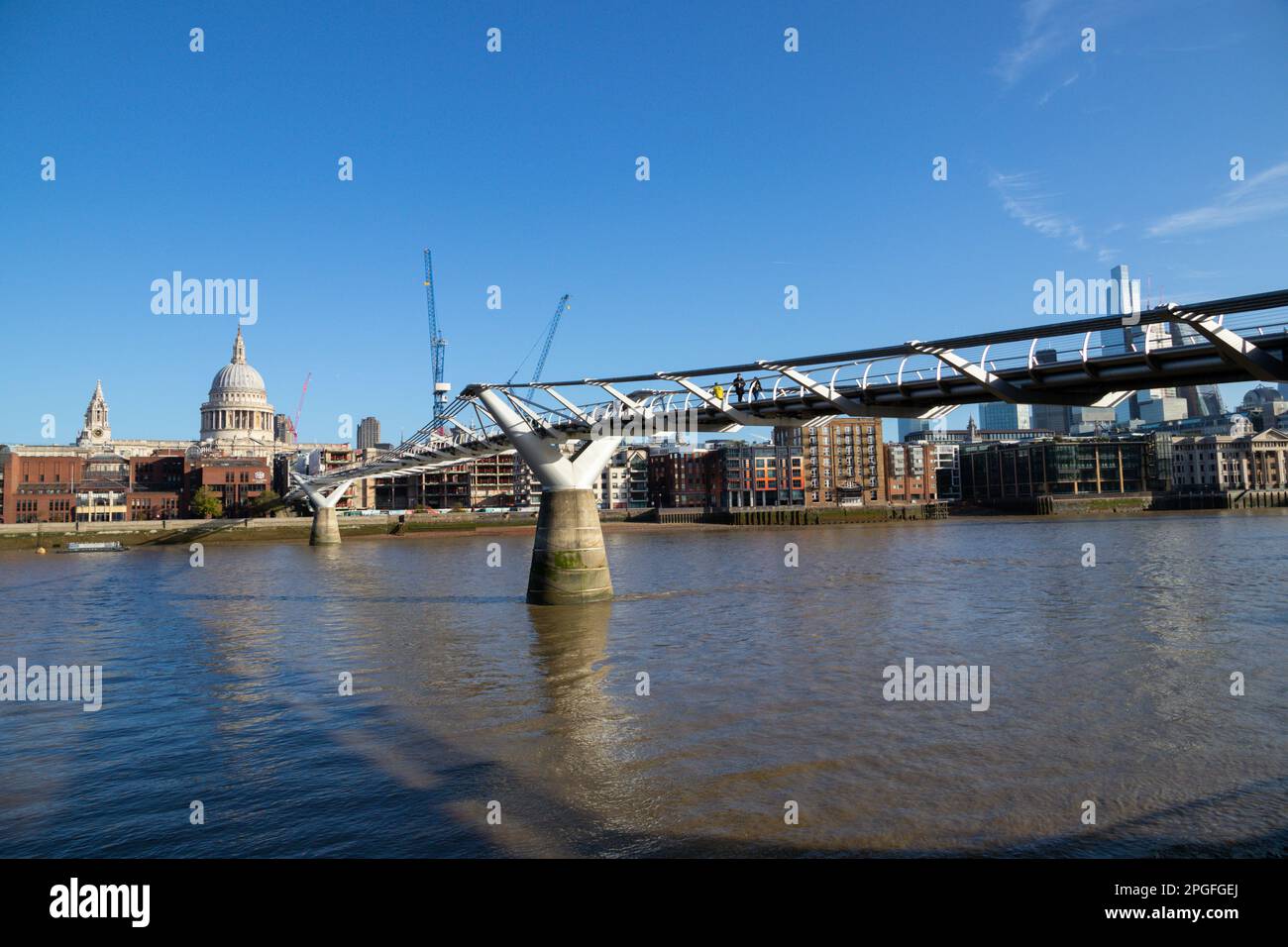 Millennium Bridge with view of St Pauls Cathedral and office blocks in the City of London behind, South Bank, London, UK Stock Photo