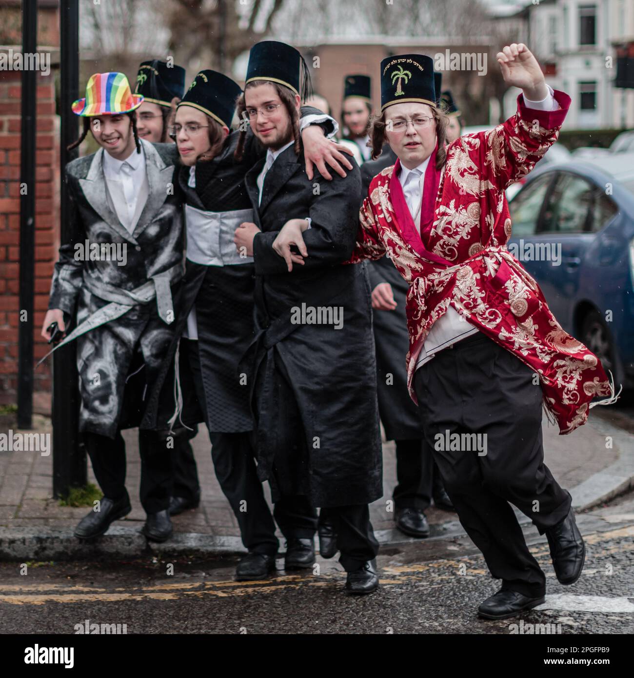 Young jewish boys celebrate at Purim 2023 on the streets of Stamford Hill in north London. Stock Photo