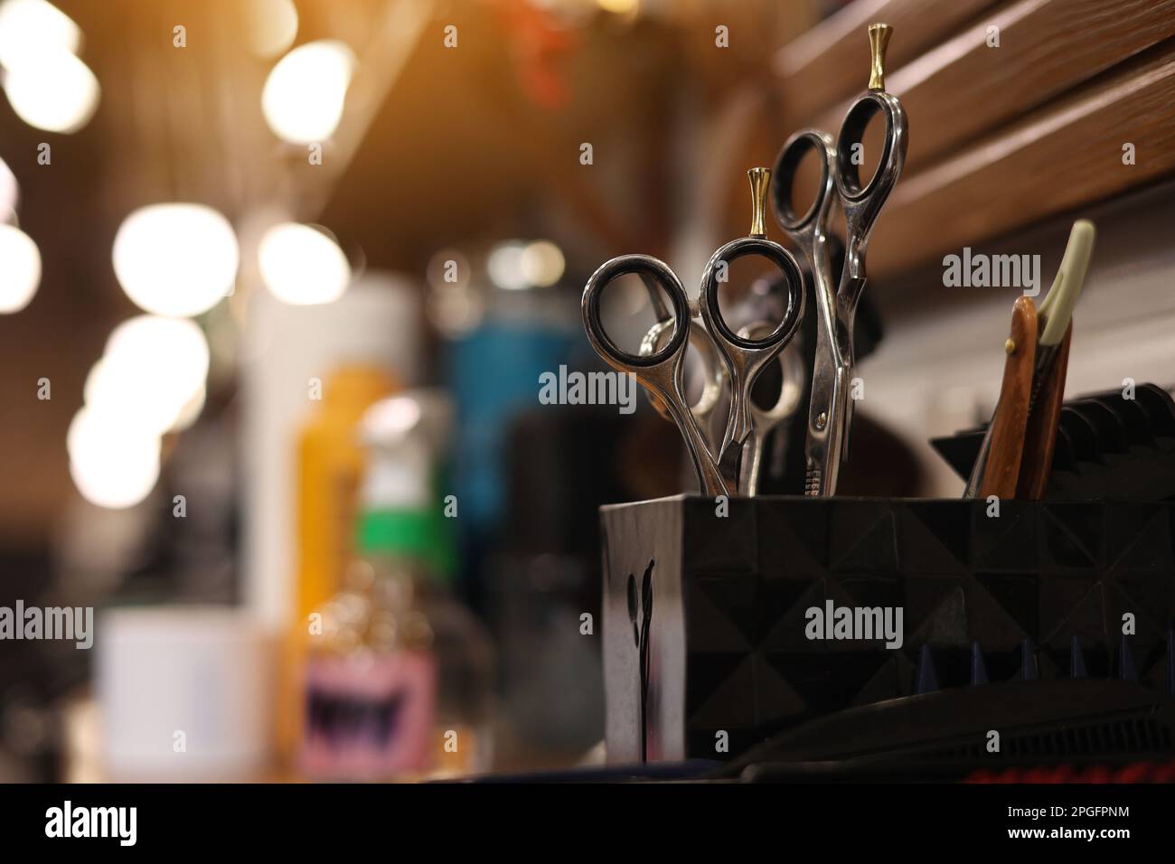 Professional hairdressing tools. Various steel scissors and combs