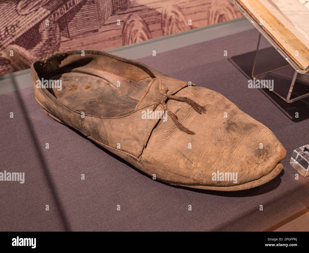 A concealed shoe (18th century) hidden in the Fitted Rigging House (*) on display in the Ropery Gallery, Historic Dockyard Chatham, Kent, UK. Stock Photo