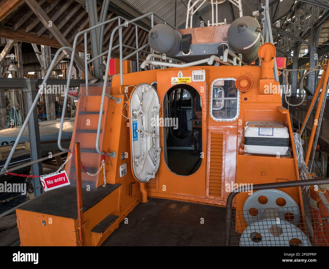 Looking into the bridge of the 'Edward Bridges' Arun class lifeboat in the RNLI Historic Lifeboat Collection, Historic Dockyard Chatham, Kent, UK. Stock Photo