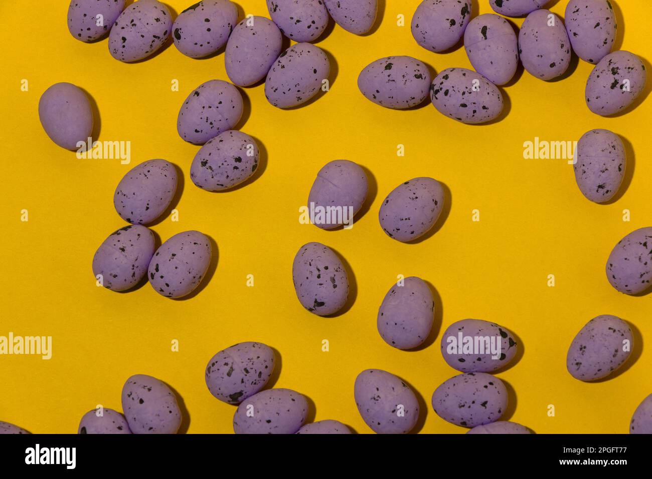 Easter eggs on the yellow background, creative design Stock Photo