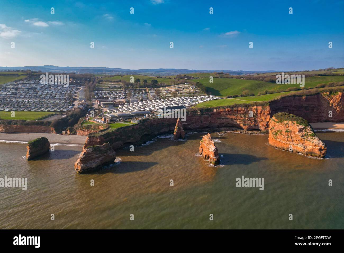 Aerial view of the sandstone rock pinnacles and cliffs at Ladram Bay ...