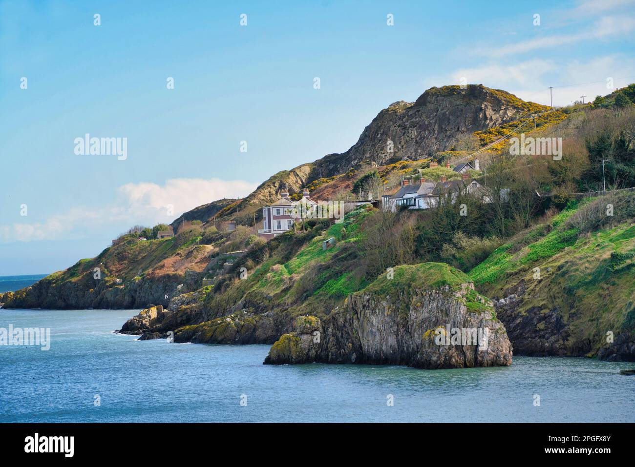 Howth Head cliff in Howth, Ireland, with houses overlooking the ocean Stock Photo