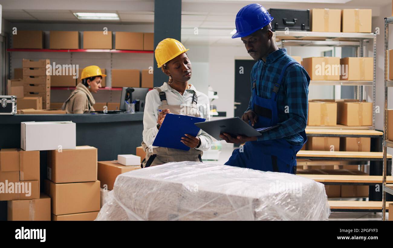 African american people in overalls analyzing products placed on ...